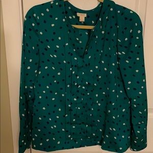 Green shirt with navy and white polka dots